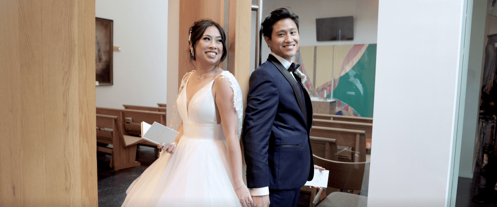 This is a picture of a  bride and groom sharing some personal vows together before their ceremony